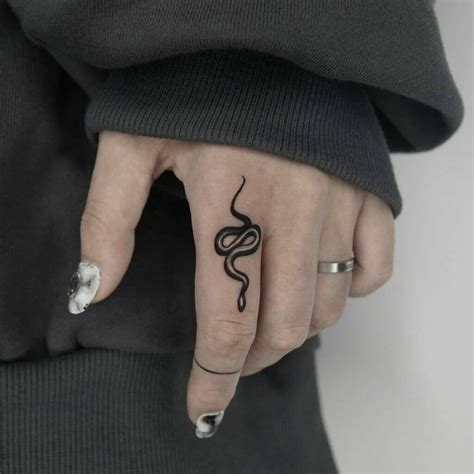 finger snake tattoo